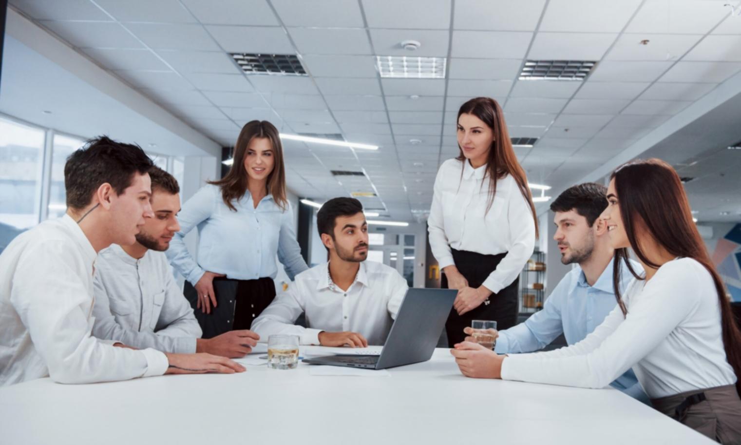 Startup founders collaborating on fundraising strategy during interactive workshop session